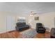 Living room with hardwood floors, ceiling fan, and comfortable seating at 1320 Moreland Dr # 20, Clearwater, FL 33764