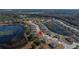 Aerial view showing home's location in a community near a lake at 13987 Weddington Ter, Hudson, FL 34669