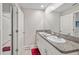 Double vanity bathroom with granite countertop at 13987 Weddington Ter, Hudson, FL 34669