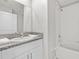 Bathroom with tub and granite countertop at 13987 Weddington Ter, Hudson, FL 34669
