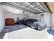 Garage with car and storage space at 13987 Weddington Ter, Hudson, FL 34669