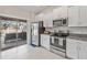 Modern kitchen with stainless steel appliances and granite countertops at 13987 Weddington Ter, Hudson, FL 34669
