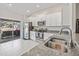 Modern kitchen with stainless steel appliances and granite countertops at 13987 Weddington Ter, Hudson, FL 34669