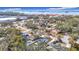 Aerial view showing home, pool, and surrounding neighborhood at 1447 Santa Anna Dr, Dunedin, FL 34698