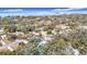 Wide aerial showcasing home and neighborhood near the water at 1447 Santa Anna Dr, Dunedin, FL 34698