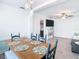 Open concept dining room with view of living room and kitchen at 1447 Santa Anna Dr, Dunedin, FL 34698