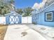 Detached garage with unique X-design doors at 1447 Santa Anna Dr, Dunedin, FL 34698