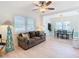 Open living area featuring hardwood floors, dining space, and couch at 1447 Santa Anna Dr, Dunedin, FL 34698
