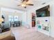 Spacious living area with hardwood floors, dining area, and kitchen view at 1447 Santa Anna Dr, Dunedin, FL 34698