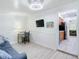 Home office with a built-in desk, couch, and hardwood floors at 1447 Santa Anna Dr, Dunedin, FL 34698