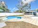 Refreshing pool with patio and adjacent shed at 1447 Santa Anna Dr, Dunedin, FL 34698