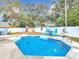 Hexagonal swimming pool with surrounding patio at 1447 Santa Anna Dr, Dunedin, FL 34698