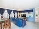 Relaxing sunroom, featuring a TV and ample seating at 1447 Santa Anna Dr, Dunedin, FL 34698