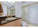 Bathroom with granite vanity and shower at 17940 Gulf Blvd # 15C, Redington Shores, FL 33708