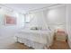 Bedroom with king-size bed and canopy at 17940 Gulf Blvd # 15C, Redington Shores, FL 33708