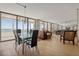 Bright dining room with glass table and ocean view at 17940 Gulf Blvd # 15C, Redington Shores, FL 33708