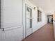 Building hallway with entrance to unit at 17940 Gulf Blvd # 15C, Redington Shores, FL 33708