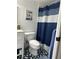 Bathroom with shower/tub combo and blue patterned floor at 18827 Tournament Trl, Tampa, FL 33647