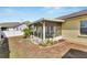 Screened porch and fenced backyard with palm trees and landscaping at 201 Lookout Dr, Apollo Beach, FL 33572