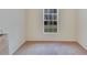 Bright bedroom with carpeted floor, window, and neutral walls at 201 Lookout Dr, Apollo Beach, FL 33572