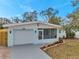 Cute and cozy home with a screened porch and updated landscaping at 2238 13Th Sw Ave, Largo, FL 33770