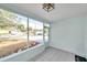 Relaxing screened porch with view of the neighborhood at 2238 13Th Sw Ave, Largo, FL 33770