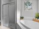 Clean bathroom with a walk-in shower and updated fixtures at 2309 Cross Tee Ct, Brooksville, FL 34604