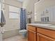 Clean bathroom with tub, shower, and updated vanity at 2309 Cross Tee Ct, Brooksville, FL 34604