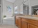 Spa-like bathroom with a garden tub and separate shower at 2309 Cross Tee Ct, Brooksville, FL 34604