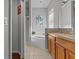 Elegant bathroom with double vanity and a soaking tub at 2309 Cross Tee Ct, Brooksville, FL 34604