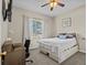Spacious bedroom with a queen-size bed and home office at 2309 Cross Tee Ct, Brooksville, FL 34604