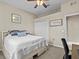 Bedroom with queen bed, closet, and ceiling fan at 2309 Cross Tee Ct, Brooksville, FL 34604