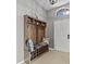 Entryway with a bench, shoe storage, and coat hooks at 2309 Cross Tee Ct, Brooksville, FL 34604