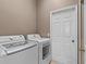 Laundry room with washer, dryer, and storage at 2309 Cross Tee Ct, Brooksville, FL 34604