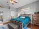 Relaxing main bedroom features a king-size bed and ensuite bathroom at 2309 Cross Tee Ct, Brooksville, FL 34604