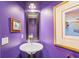 Small bathroom with pedestal sink and purple walls at 2503 Pass A Grille Way, St Pete Beach, FL 33706