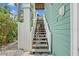 Exterior stairs leading to a lower level at 2503 Pass A Grille Way, St Pete Beach, FL 33706