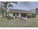 Private patio with seating and beautiful landscaping at 2579 Bay Berry Dr # 42D, Clearwater, FL 33763