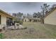 Spacious backyard with patio, and grassy area at 2579 Bay Berry Dr # 42D, Clearwater, FL 33763