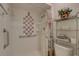 Updated bathroom with a walk-in shower and storage at 2579 Bay Berry Dr # 42D, Clearwater, FL 33763
