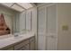 Bathroom features a vanity with storage and a large mirror at 2579 Bay Berry Dr # 42D, Clearwater, FL 33763