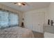 Bedroom with a queen bed, ceiling fan, and ample closet space at 2579 Bay Berry Dr # 42D, Clearwater, FL 33763