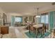 Bright and airy living room with a comfy seating area and dining space at 2579 Bay Berry Dr # 42D, Clearwater, FL 33763