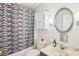 Clean bathroom with shower/tub combo, vanity, and updated fixtures at 2700 Bayshore Blvd # 1305, Dunedin, FL 34698