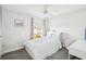Cozy bedroom with a double bed and a ceiling fan at 2700 Bayshore Blvd # 1305, Dunedin, FL 34698