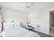 Bright bedroom with double bed, ceiling fan, and workspace at 2700 Bayshore Blvd # 1305, Dunedin, FL 34698