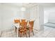 Bright dining area with wood table and chairs at 2700 Bayshore Blvd # 1305, Dunedin, FL 34698