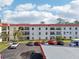 Building exterior showcasing ample parking and a water view at 2700 Bayshore Blvd # 1305, Dunedin, FL 34698