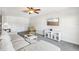 Living room with sectional sofa, TV, and built-in shelving at 2700 Bayshore Blvd # 1305, Dunedin, FL 34698