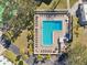 L-shaped community pool with plenty of lounge chairs at 2700 Bayshore Blvd # 1305, Dunedin, FL 34698